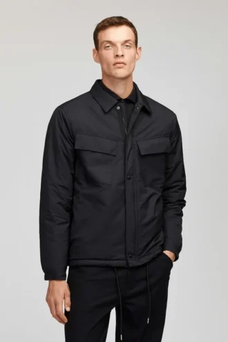 Den quiltade Coachs-jackan