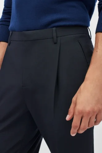 Plisserade stretchbyxor i ull